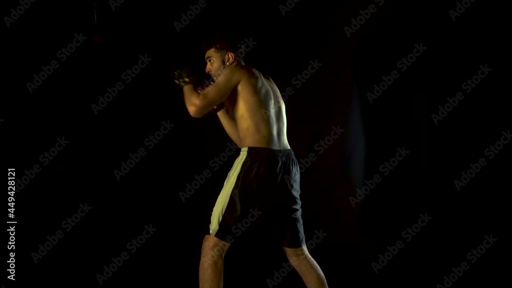 Male Boxer MMA Athlete Strong Fighter in Dark Background Male Boxer MMA Athlete Strong Fighter in Dark Background