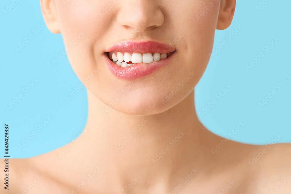 Young woman with beautiful lips on color background, closeup Young woman with beautiful lips on color background, closeup