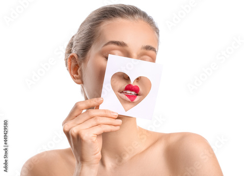 Beautiful young woman holdi...