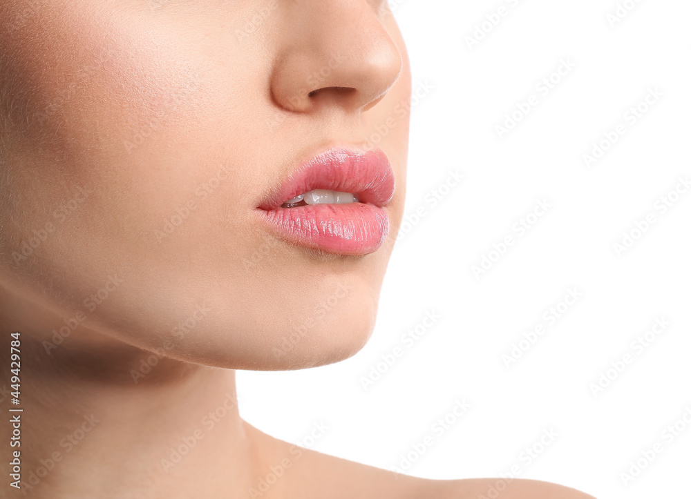 Obraz premium Young woman with beautiful lips on white background, closeup