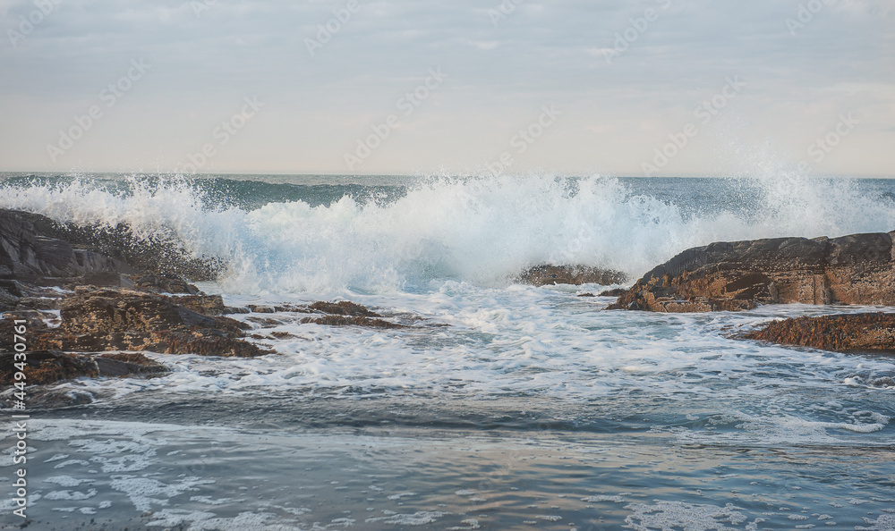 Dramatic scene with Sea waves crashing on rocks