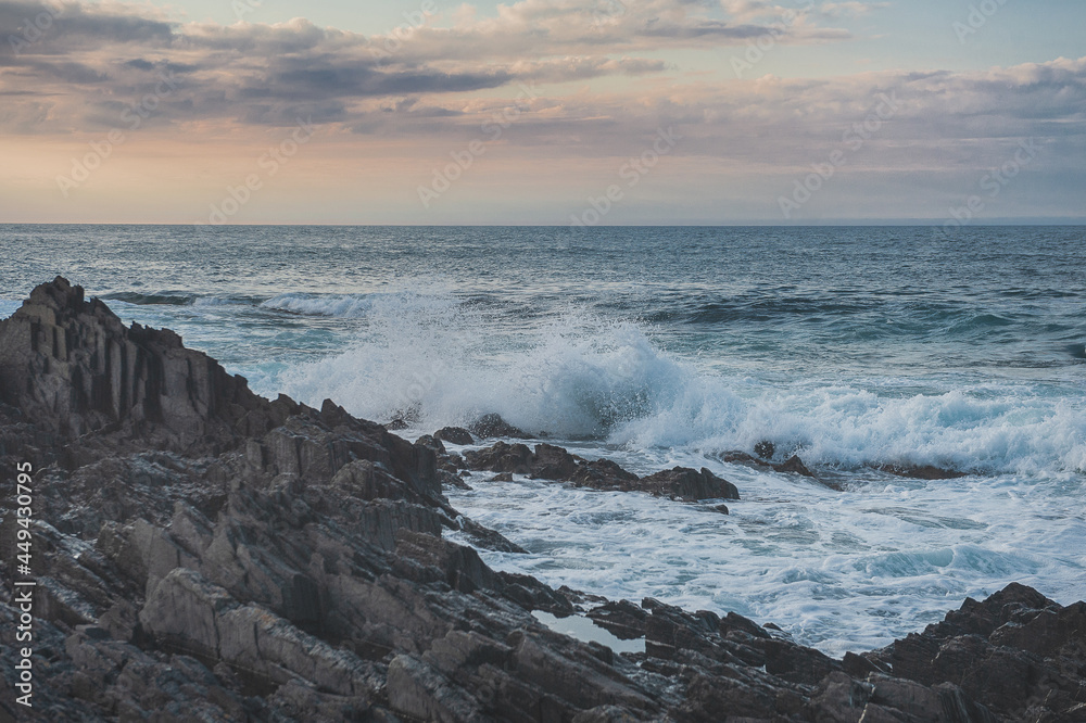 Dramatic scene with Sea waves crashing on rocks