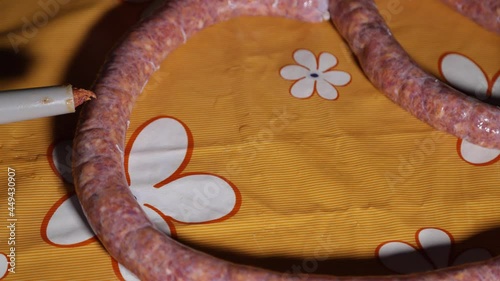 Timelapse close up stuffing sausages