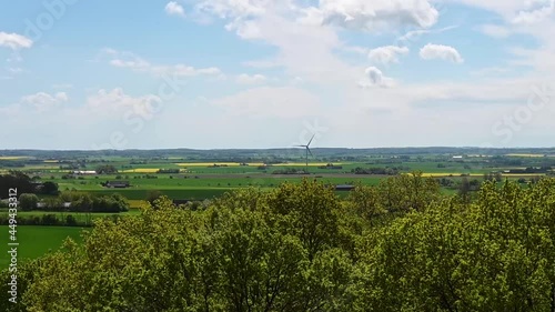 Flat farmland in Skåne Sweden with renewable wind turbine energy