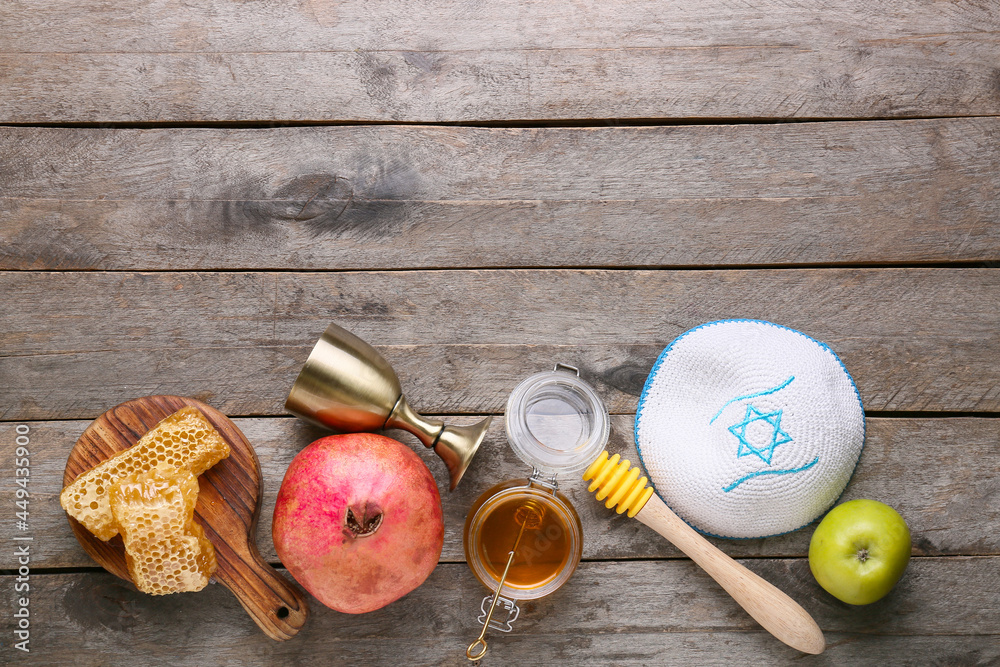 Symbols of Rosh hashanah (Jewish New Year) and kipa on wooden background Symbols of Rosh hashanah (Jewish New Year) and kipa on wooden background