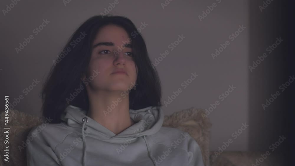 Teen girl watching TV at night Teen girl watching TV at night