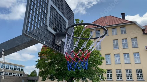Basketball hoop with the metal board on a school site