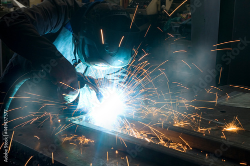 welder at work close up with sparks