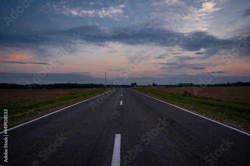 Road in the village in the evening in summer