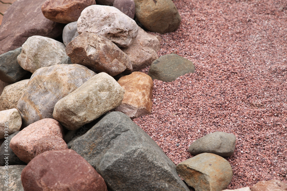 Boulders, huge stones, decorative design next to small stones Boulders, huge stones, decorative design next to small stones
