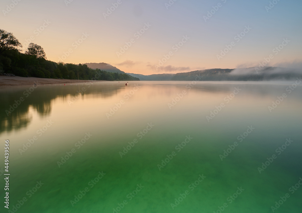 Lac de Chalain in the Jura regio of France where in the morning the mist comes frome land over the lake