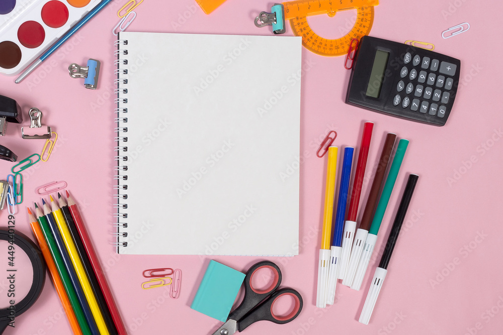 School stationery on pink background. Close-up School stationery on pink background. Close-up