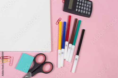School stationery on pink background. Close-up