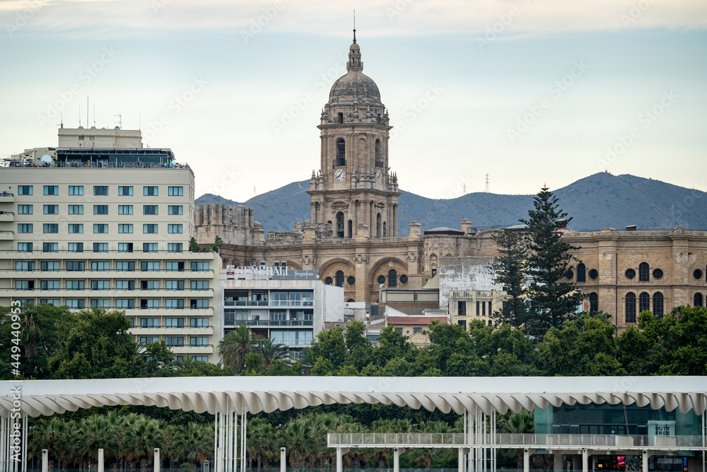 Views of the buildings of the city of Malaga during the sunset, with the Church of the Incarnation