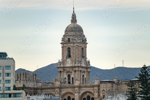 Views of the buildings of the city of Malaga during the sunset, with the Church of the Incarnation