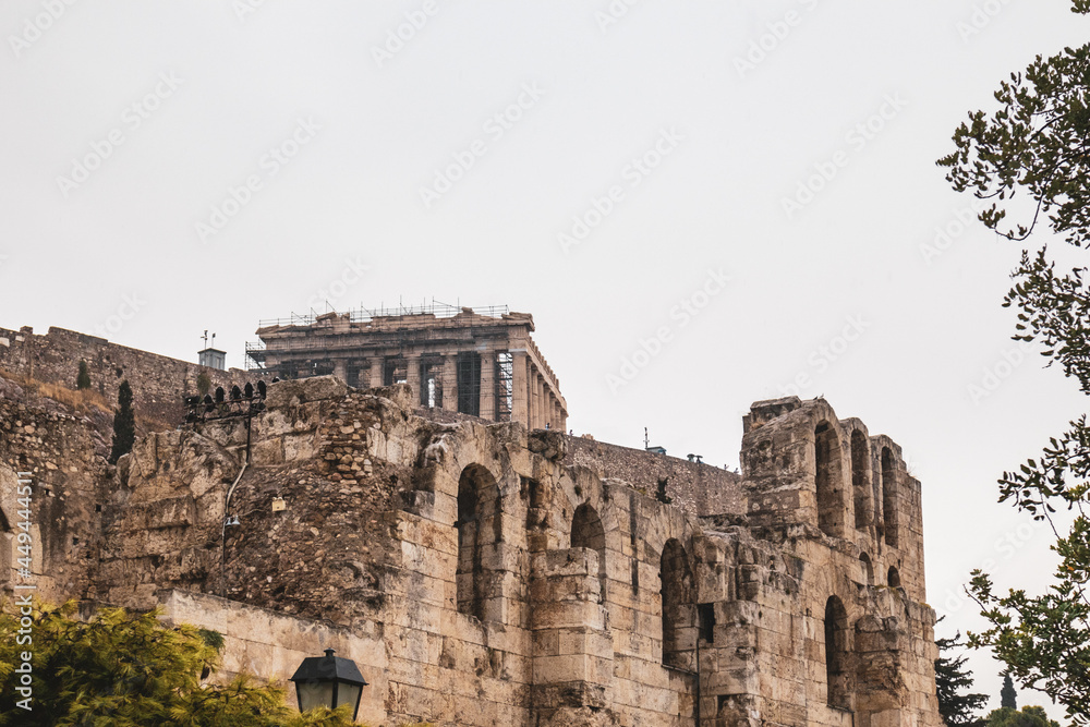 Entrance square to Odeon of Herodes Atticus framed with trees on hills of Acropolis, Athens, Greece