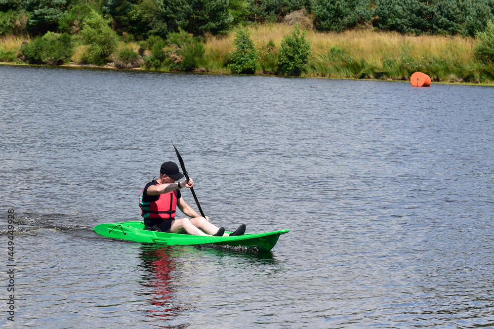 Green kayak in Loch Lomond during summer 