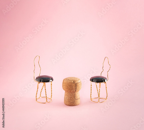 Wine stopper on a pink background.  Creative abstract minimal concept made of cork for wine and metal zipper.