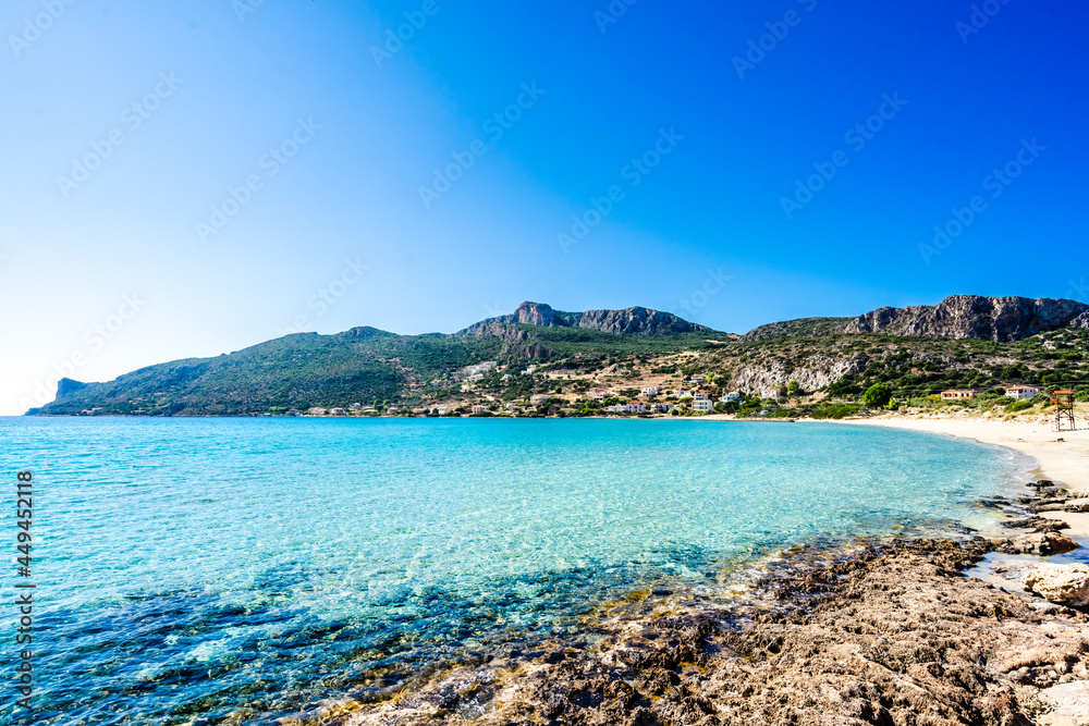 Turquoise water and white beach at village Plitra in Lakonia, Peloponnese Greece