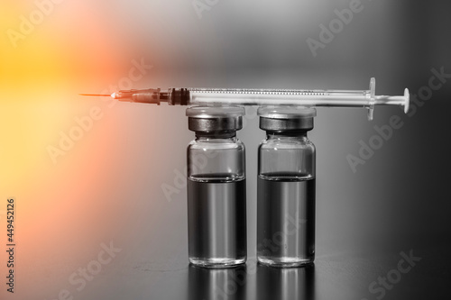 Covid-19 corona virus vaccination with vaccine bottle photo