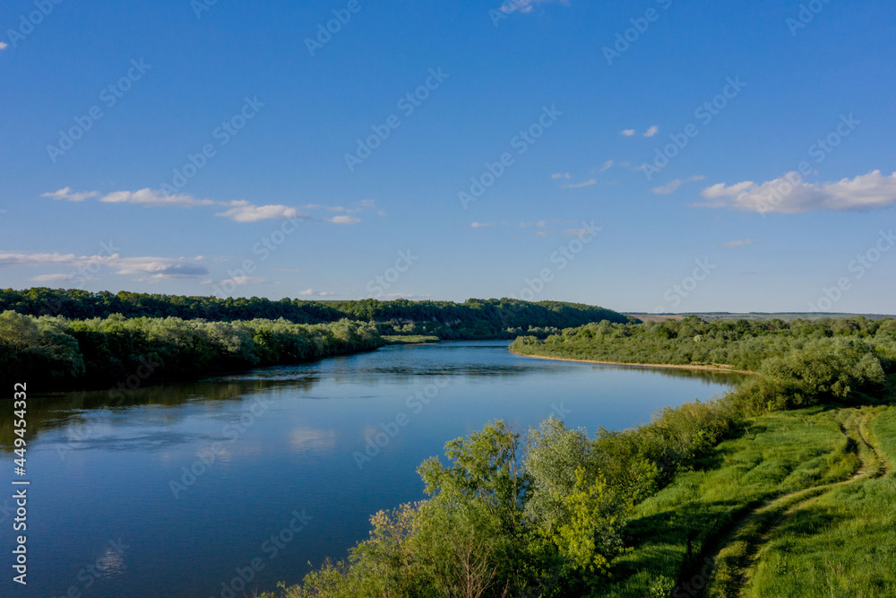Stunning top view of the sinuous Dniester River. Summer landscape of the Dniester River. Picturesque photo wallpaper. Discover the beauty of earth