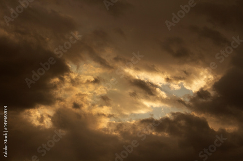 Dramatic sunset sky. Magical view of the dusk red, orange and yellow colors in the clouds and sky.