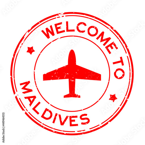 Grunge red welcome to Maldives word with airplane icon round rubber seal stamp on white background