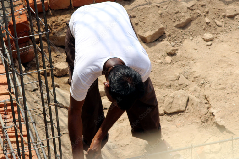 WORKER WORK AT CONSTRUCTION SITE