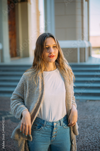 Outdoor portrait of young elegant fashionable young Latin woman walking in street of Brazil