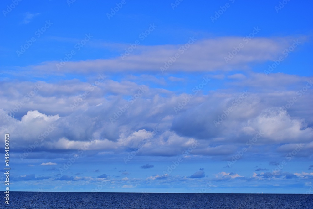 Blue sky with white clouds above the North Sea