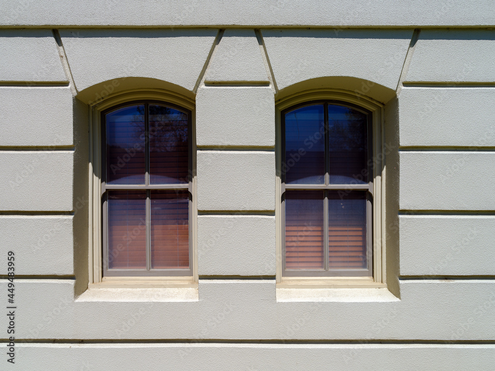 Paired segmental arched windows on an historic building located in Dayton, Washington, USA