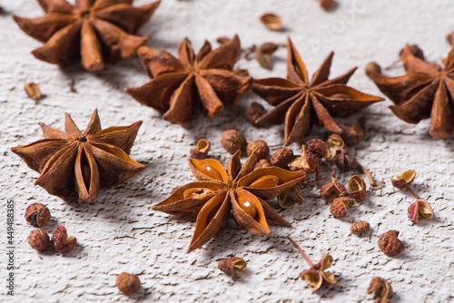 anise stars on white table background