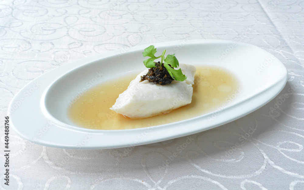 steamed slices grouper fish fillet with Chinese herbal fungus miso sauce seafood in white background asian halal seafood menu steamed slices grouper fish fillet with Chinese herbal fungus miso sauce seafood in white background asian halal seafood menu