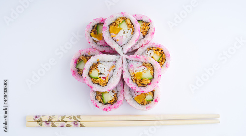 Top view of a beautiful pattern arranged with two layers of sushi, copy space
