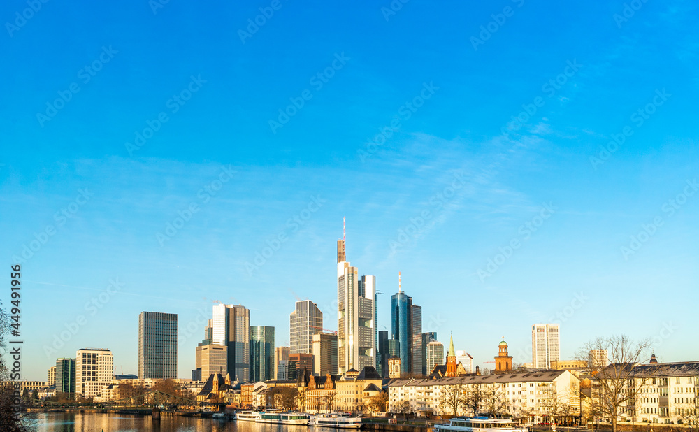 Skyline of Frankfurt, Germany and surrounding skyscrapers in sunny weather under blue sky