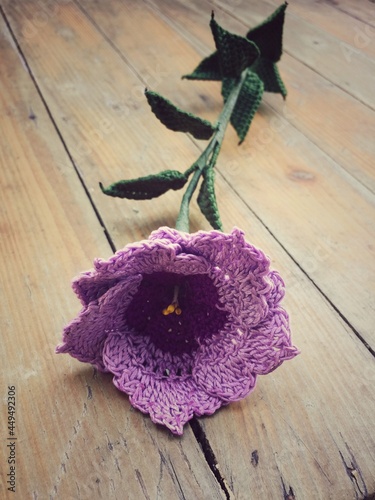 pink rose on a wooden table
