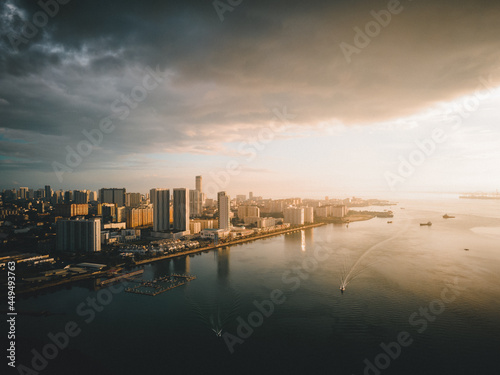 city skyline with sea view at sunrise