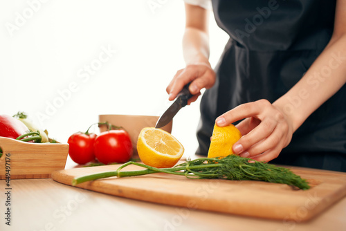 slicing lemon on the board with a knife kitchen cooking ingredients