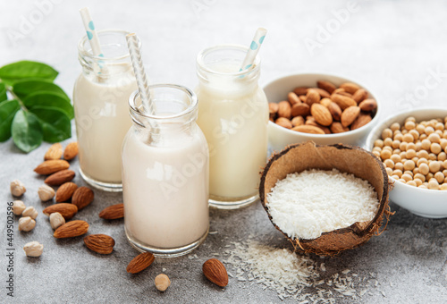 Obraz na plátně Alternative types of vegan milks in glass bottles