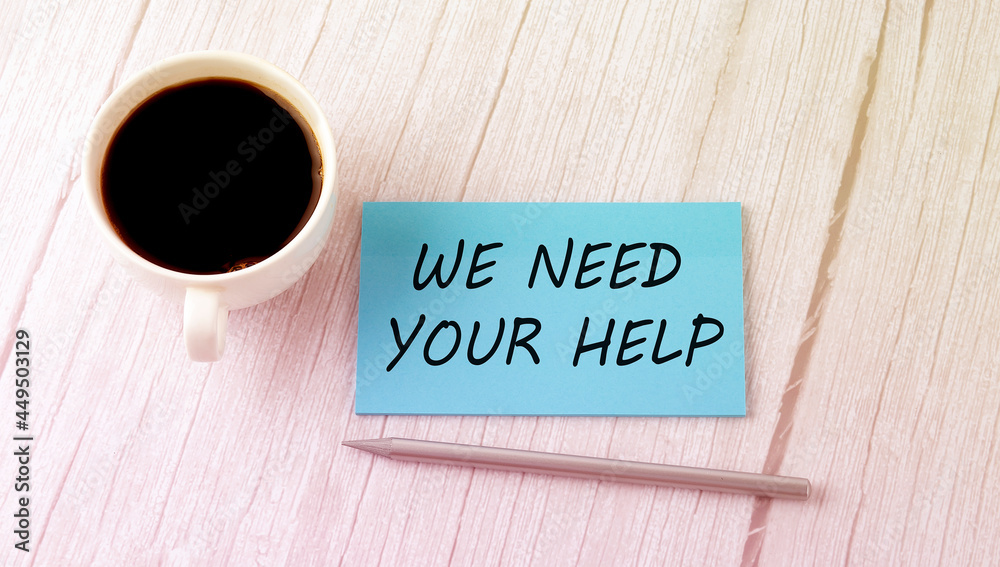 NEED YOUR HELP text on the blue sticker with cofee and pen NEED YOUR HELP text on the blue sticker with cofee and pen