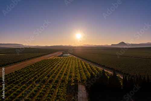 aerial view of the countryside, the sky and the sun at sunset
