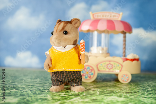 
Sylvanian families. The Sylvanian family are eating ice cream in a meadow. Ukraine, Kharkiv, 08/07/2021 photo