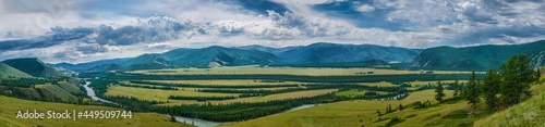 Fototapeta Naklejka Na Ścianę i Meble -  Panoramic view of plain with forest and mountains on background 
