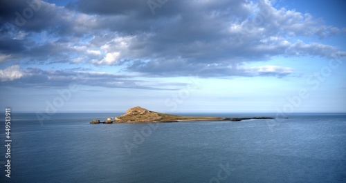 Ireland's Eye island, evening, beautiful front view from Howth harbor
