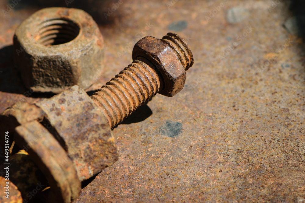 rusty nut. Rusty iron rod with screw threads. Rusted mechanical components. threaded bolt and nut isolated close up. dismantling concept, difficult to unscrew, non-removable. space for text rusty nut. Rusty iron rod with screw threads. Rusted mechanical components. threaded bolt and nut isolated close up. dismantling concept, difficult to unscrew, non-removable. space for text