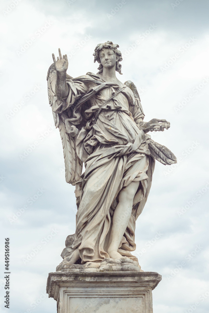 Rome,Italy - July 19, 2021 :Angel with the Nails at Ponte Sant'Angelo.One of the series of Angels with the Instruments of the Passion on the Ponte Sant'Angelo,Rome,Italy. Sculpture by Girolamo Lucenti