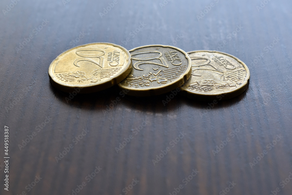 20 Euro cent coins on wood table. 20 Euro cent coins on wood table.