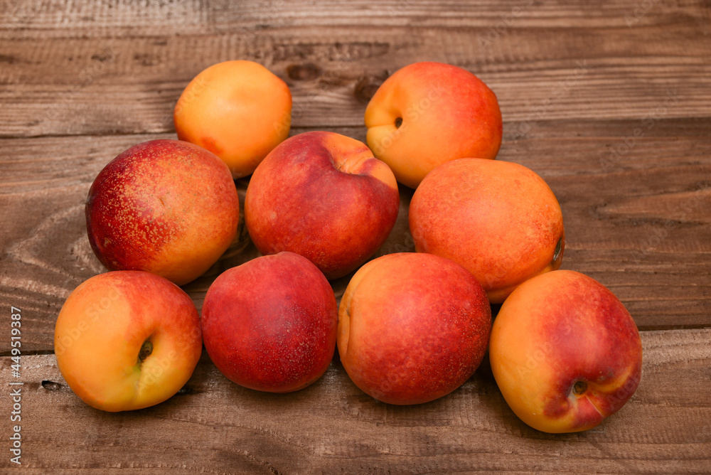 ripe yellow with red apricots on a wooden brown table ripe yellow with red apricots on a wooden brown table