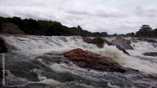 A Pan view of the mighty cauvery river flowing ferociously before reaching the Gaganachukki waterfall at Shivanasamudra in Karnataka, India.