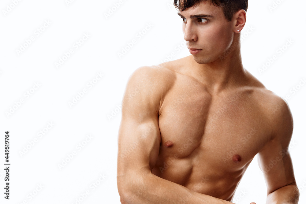Fototapeta premium male athlete with biceps and cubes on the stomach naked torso model